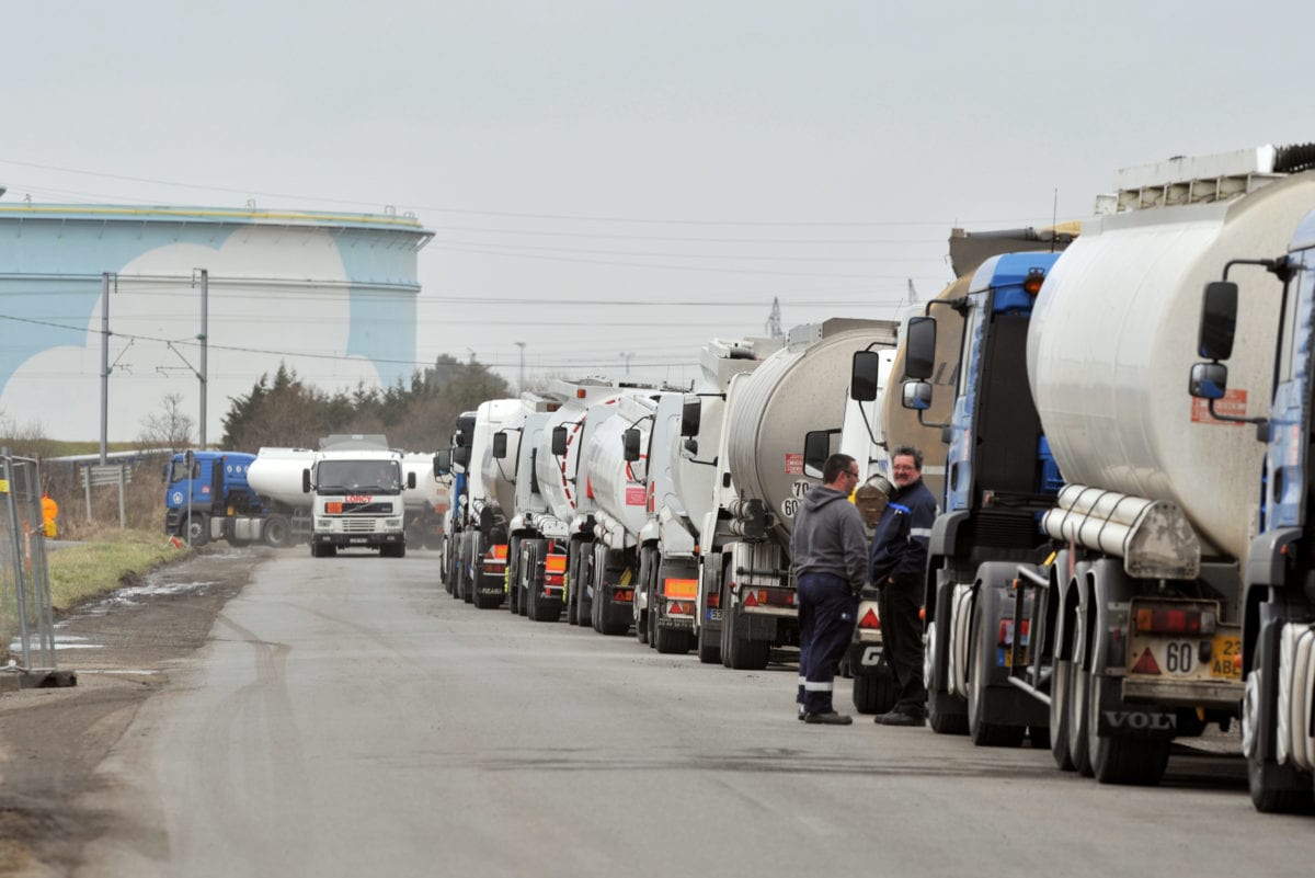 Drivers of oil tankers in a convoy queue, on February 22, 2010 [FRANK PERRY/AFP/Getty Images]