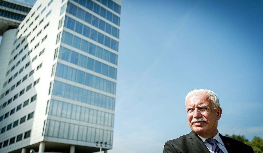 The Foreign Minister of the Palestinian Authority, Riyad al-Maliki, leaves the International Criminal Court (ICC) in The Hague, on 25 June, 2015 [ROBIN VAN LONKHUIJSEN/AFP/Getty Images]