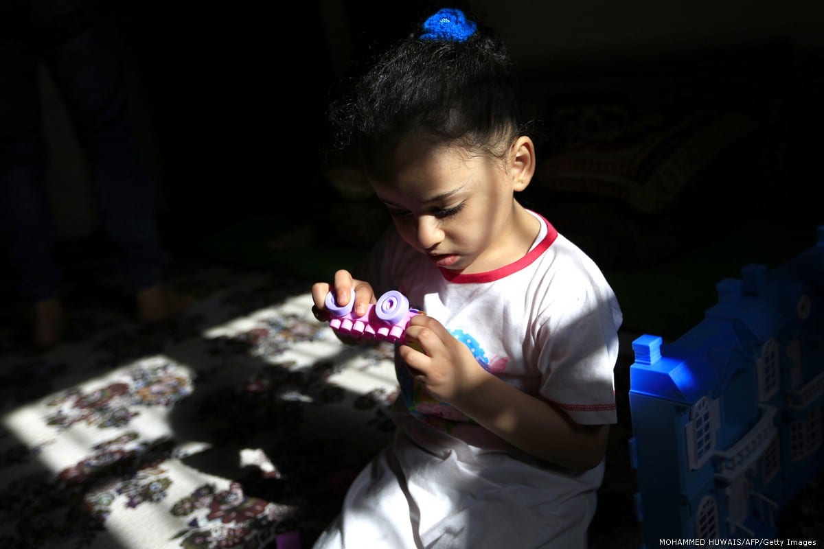 A Yemeni girl plays with toys in Sanaa, Yemen [MOHAMMED HUWAIS/AFP/Getty Images]
