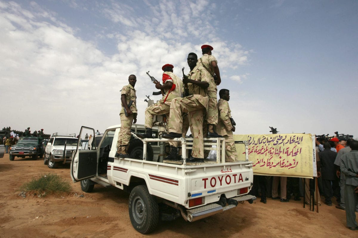 Sudanese presidental guards secure the area during a speech by President Omar al-Beshir in El-Fasher, north Darfur on 23 July 2008. [KHALED DESOUKI/AFP/Getty Images]