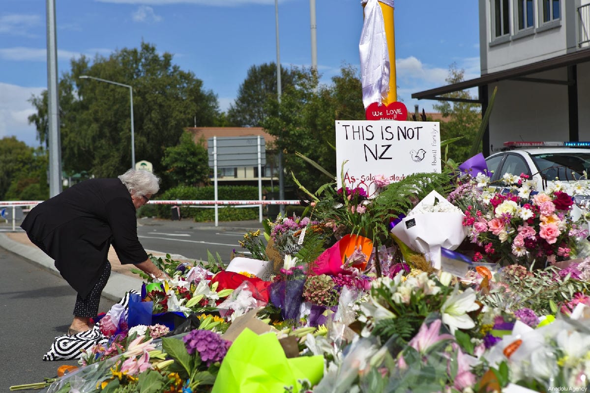 People pay tribute close to the Al Noor Mosque, following a mass shooting on March 15, in Christchurch, New Zealand on March 16, 2019 [Peter Adones / Anadolu Agency]