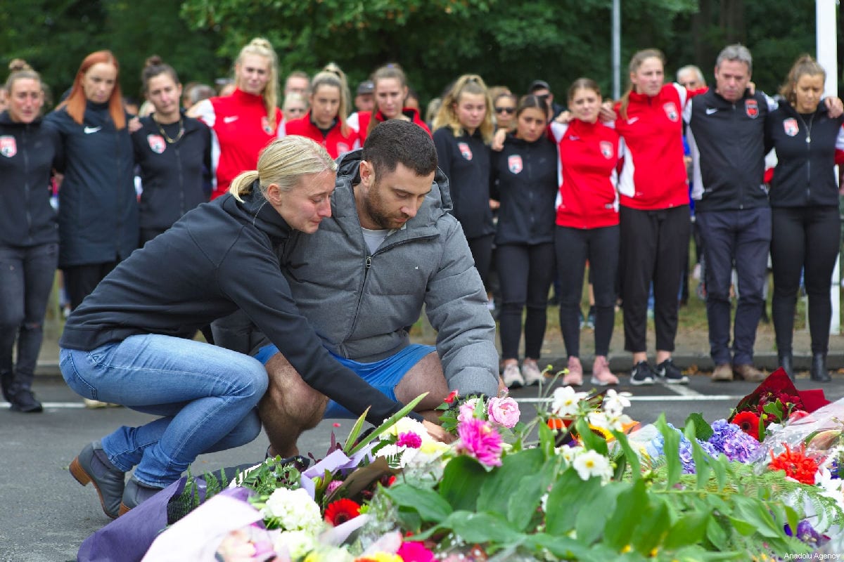 Members of the Canterbury United Pride soccer team pay tribute to their goal keeper who died at the Masjid Al Noor Mosque attack on March 15, in Christchurch, New Zealand on March 17, 2019 [Peter Adones / Anadolu Agency]