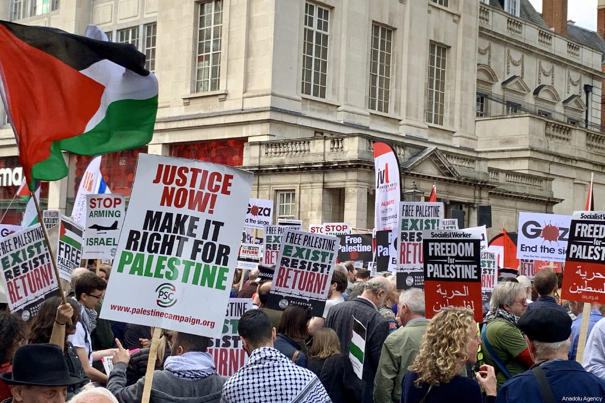 Hundreds of protesters gather in front of the Israeli Embassy in central London in solidarity with Palestinian people who are holding large "Great March of Return" and "Palestinian Land Day" rallies across Gaza border, in London, United Kingdom on March 30, 2019 [Hasan Esen / Anadolu Agency]