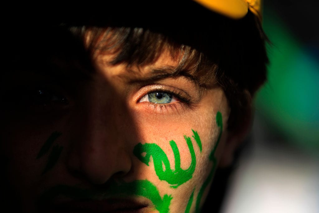 A Muslim Yemeni boy with the world "Allah" in Arabic painted on his face attends a rally in the capital Sanaa on the occasion of the Prophet Mohammed's birthday on 30 November, 2017 [MOHAMMED HUWAIS/AFP/Getty Images]