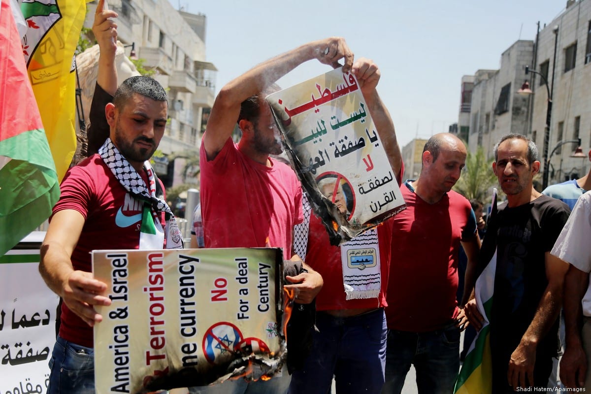 Palestinians stage a protest against the 'Deal of the Century', planned by US President Donald Trump to solve the conflict between Palestine and Israel, in Ramallah, West Bank on 2 July 2018 [Shadi Hatem/Apaimages]