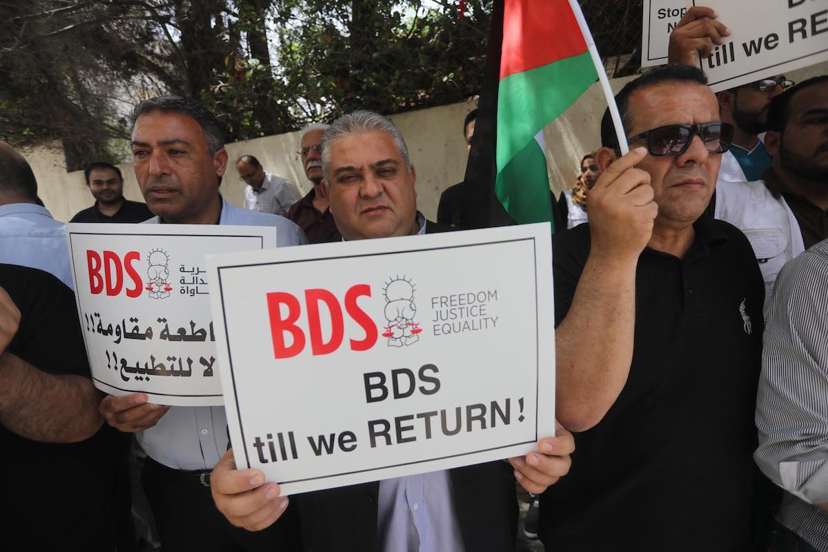 Palestinians in Gaza protest against German Parliament decision on BDS, in Gaza on 23 May 2019 [Mohammed Asad/Middle East Monitor]