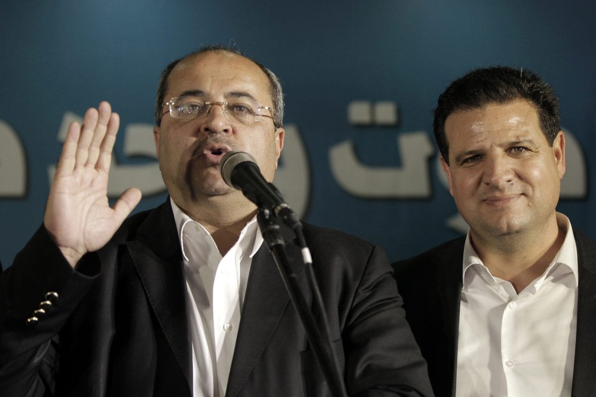 Hadash-Ta’al leader Ahmad Tibi (L) and Ayman Odeh on 17 March 2015 [AFP PHOTO AHMAD GHARABLI/Getty]