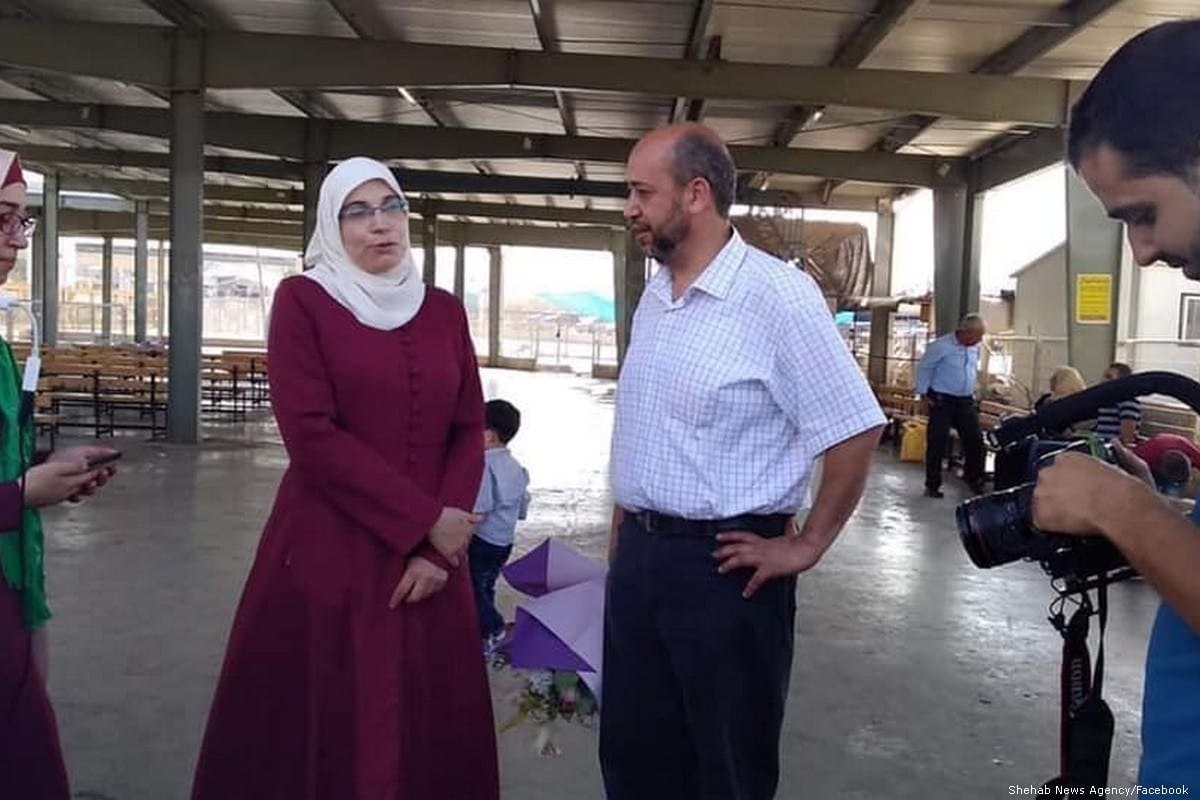 Palestinian writer and journalist Lama Khater talks to press after she was released from prison on 26 July 2019 [Shehab News Agency/Facebook]