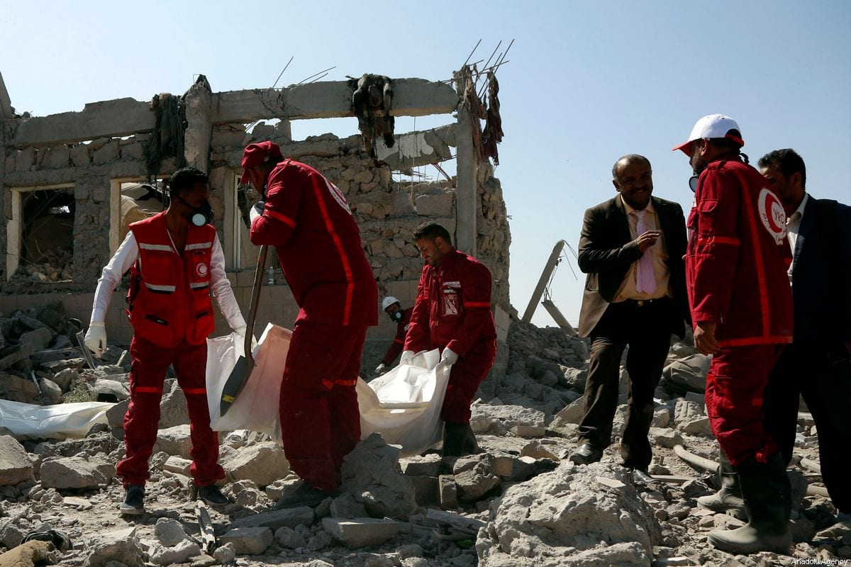 Yemen Red Crescent members conduct an operation after coalition forces led by Saudi Arabia carried out air strikes in Dhamar, Yemen on 1 September 2019 [Mohammed Hamoud/Anadolu Agency]