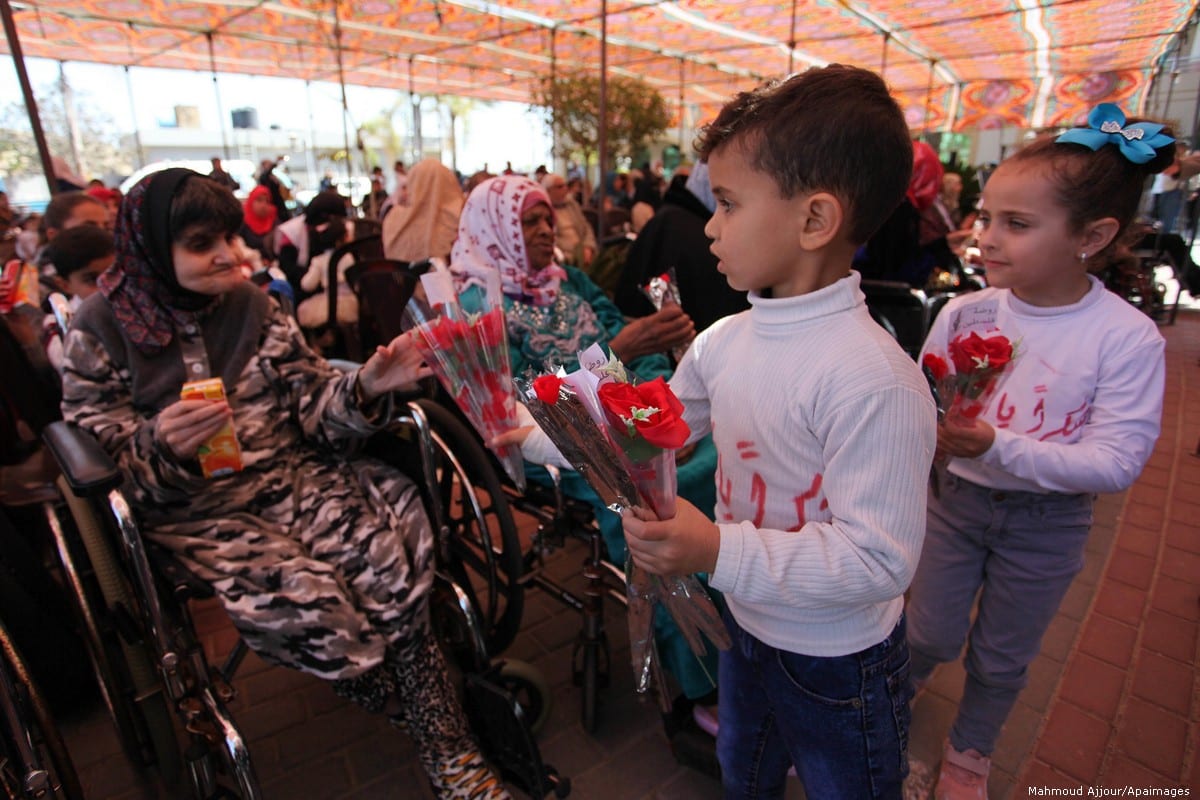 Palestinian elderly take part during a celebration on the occasion of Mother's Day, at a nursing home in Gaza city, on 21 March 2019 [Mahmoud Ajjour/Apaimages]