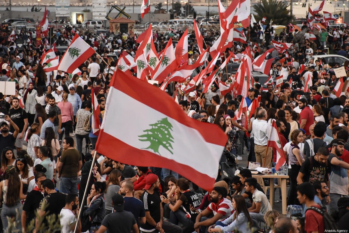 Demonstrators gather to stage a protest against the government's policy on easing the economical crisis in Beirut, Lebanon on October 22, 2019 [Mahmut Geldi / Anadolu Agency]