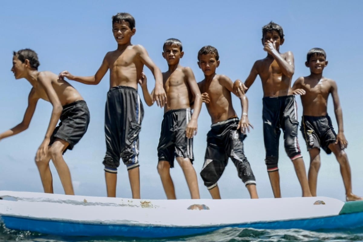 A still from the film 'Gaza' shows a Palestinians boys playing on the beach