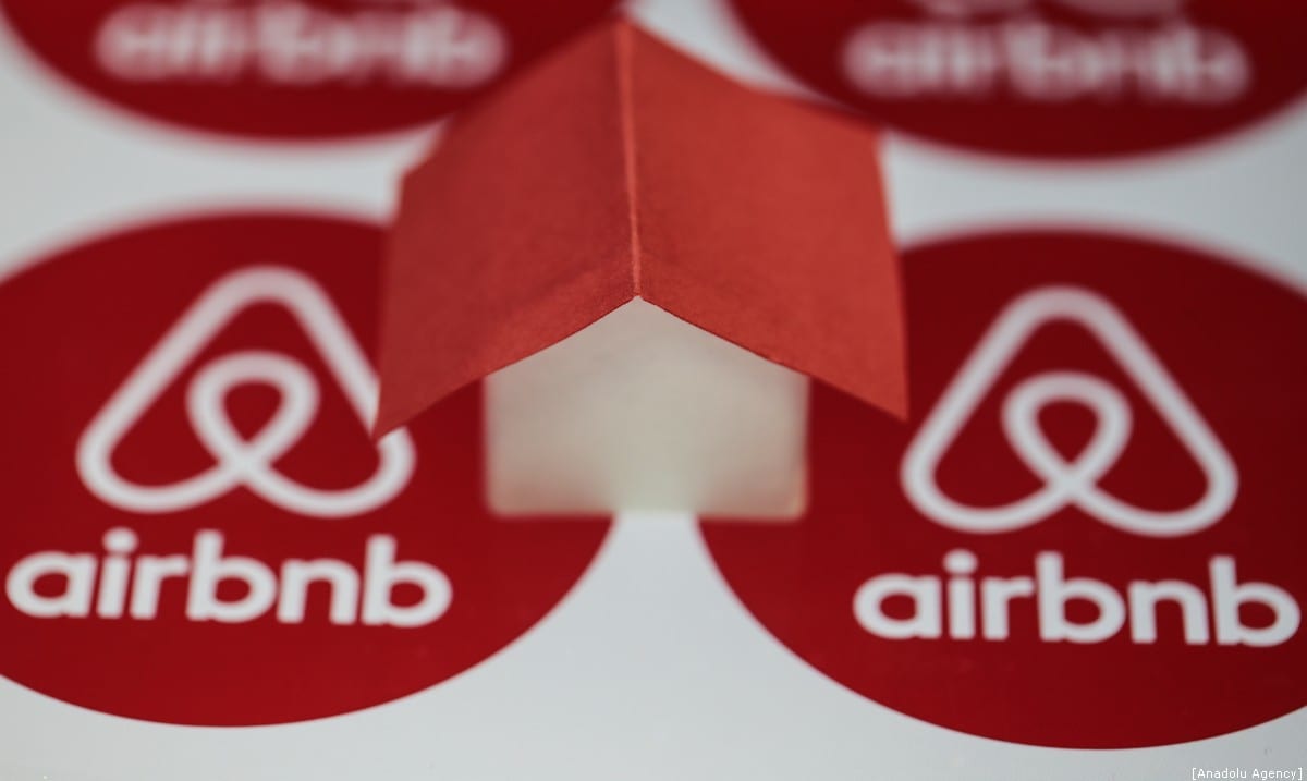 Logos of Airbnb are seen with a house mock-up onto it, on December 30, 2019 in Ankara, Turkey. [Metin Aktaş/Anadolu Agency]