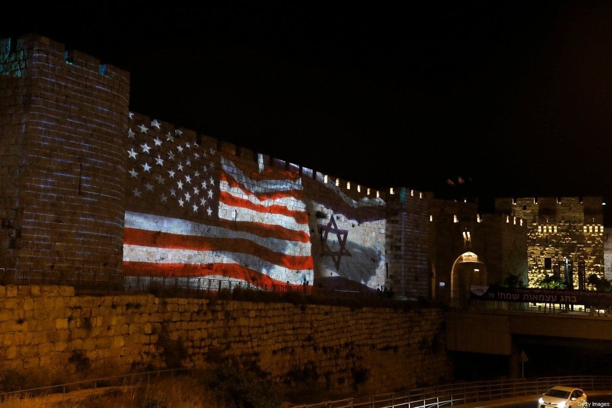 The Israeli and United States flags are projected on the walls of the ramparts of Jerusalem's Old City, to mark one year since the transfer of the US Embassy from Tel Aviv to Jerusalem on May 15, 2019. [AHMAD GHARABLI/AFP via Getty Images]
