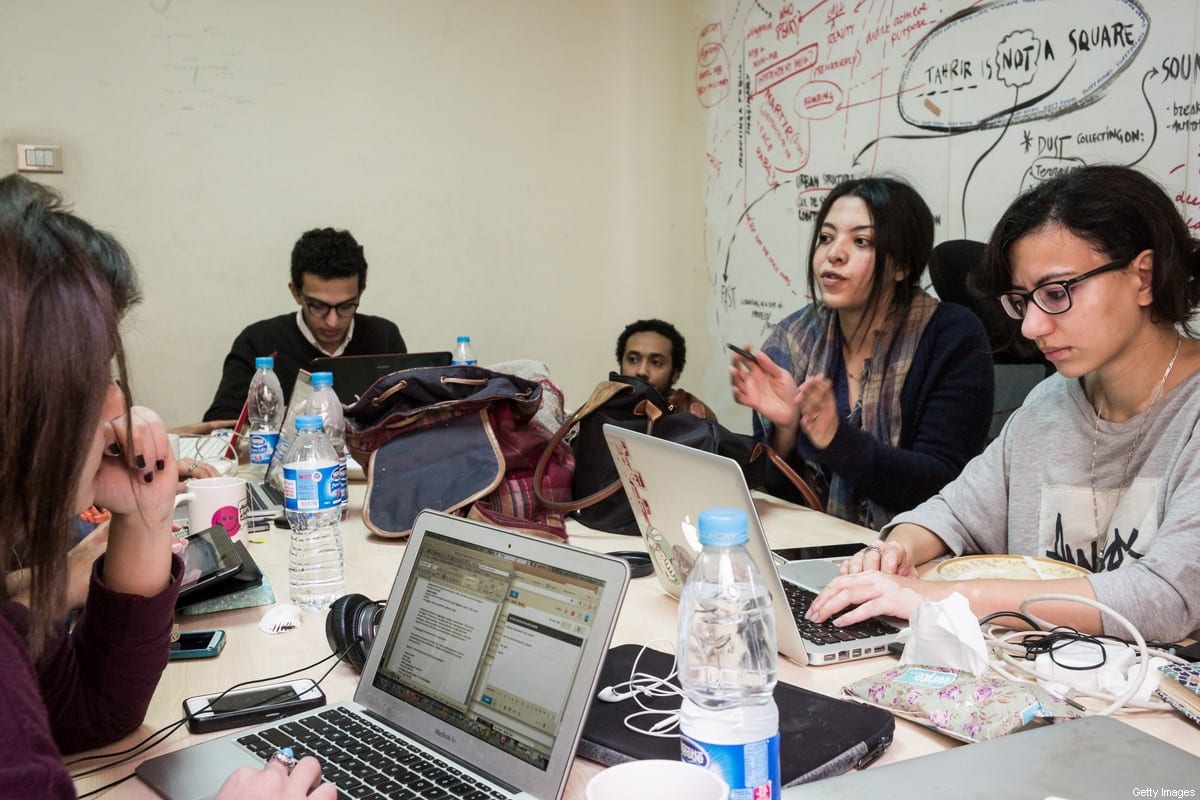 Members of Mada Masr work in their office on January 25 2015 in Cairo, Egypt.Mada Masr is a Cairo-based independent news website [David Degner/Getty Images]