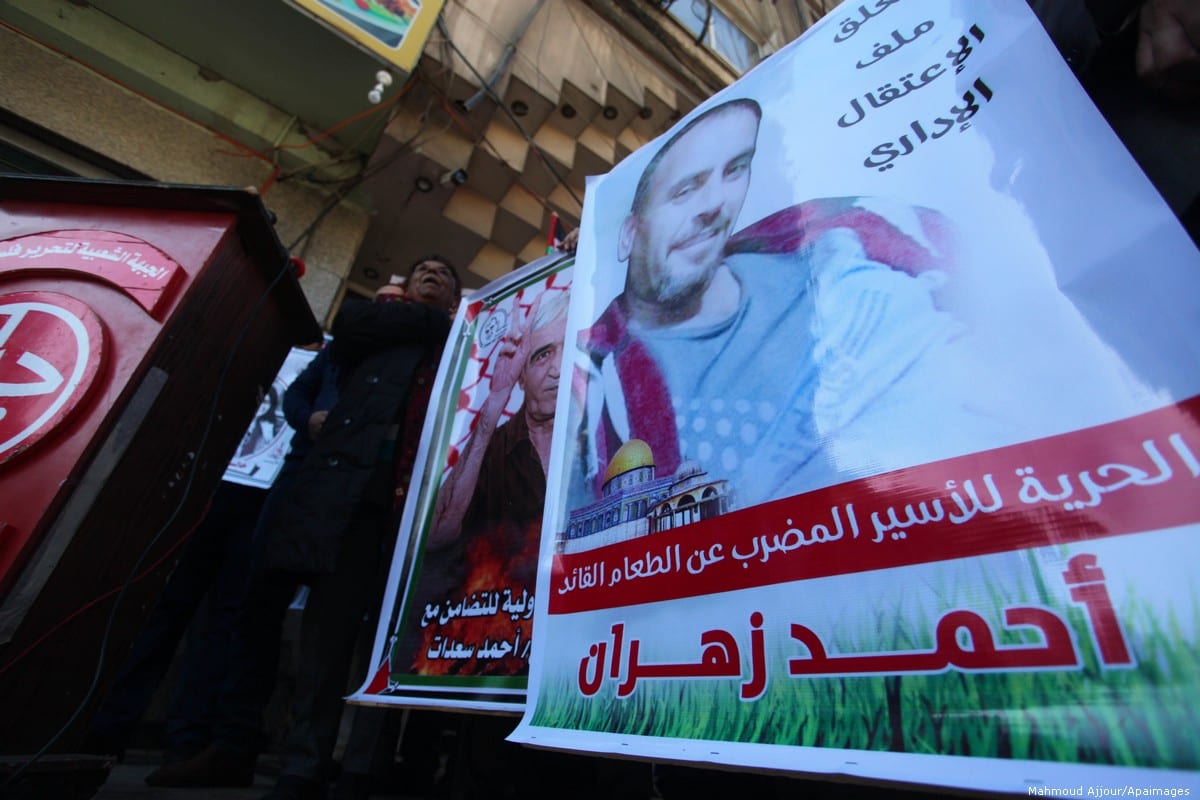 Palestinians take part in a protest to show solidarity with prisoner on on hunger strike, Ahmed Zahran helds in Israeli jails, in Gaza City on 19 December 2019 [Mahmoud Ajjour/Apaimages]