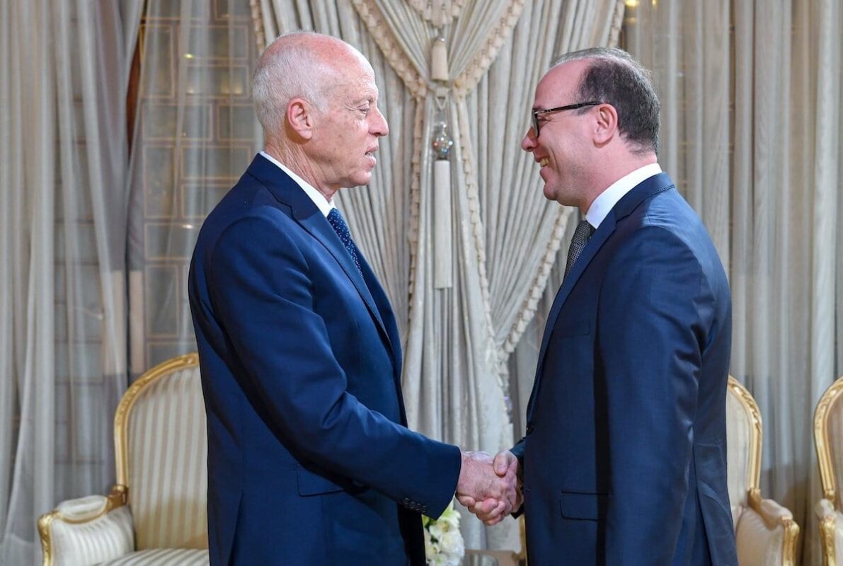 Tunisian President Qais Saied (L) gives letter of tasking to Tunisian former Finance Minister Elyes Fakhfakh (R) to form new government at the Carthage Palace in Tunis, Tunisia on January 21, 2020 [Tunisian Presidency / Handout - Anadolu Agency]