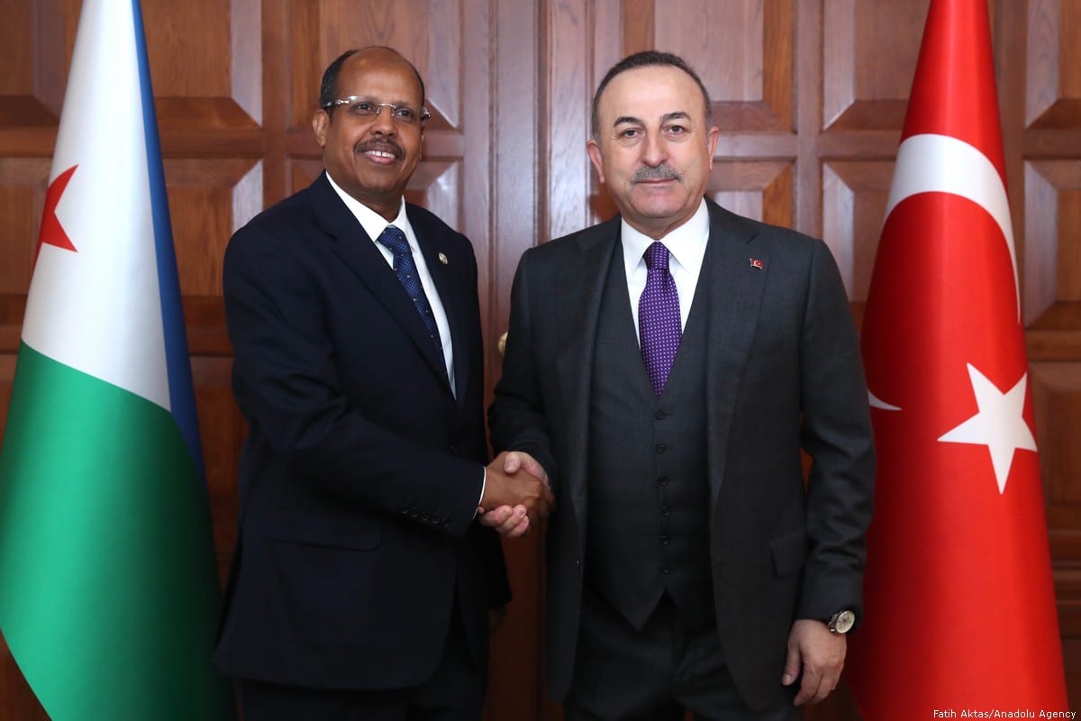 Turkish Foreign Minister Mevlut Cavusoglu and Djibouti's Foreign Minister Ilyas Moussa Dawaleh pose for a photo during a land swap protocol signing ceremony held for the Embassies in Ankara, Turkey on 19 February 2020. [Fatih Aktaş - Anadolu Agency]