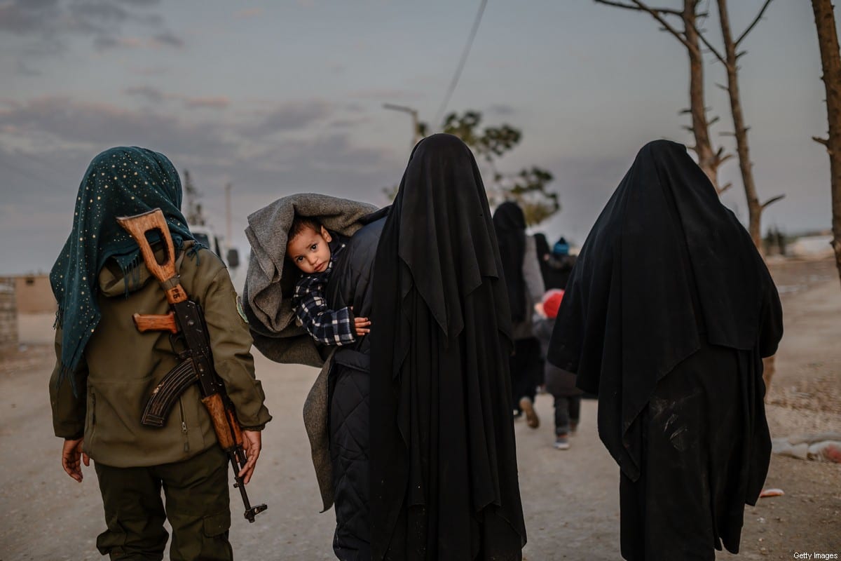 Veiled women, reportedly wives and members of Daesh, at al-Hol camp in northeastern Syria on February 17, 2019 [BULENT KILIC/AFP via Getty Images]