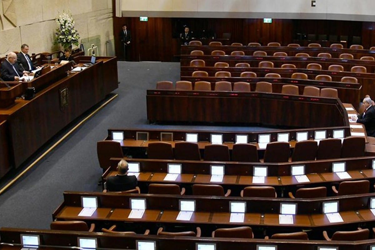 Israeli MPs took oaths in groups of threes as a preventive measure against the coronavirus (Covid-19), leaving many seats empty throughout the Knesset session on 16 March 2020 [Mark Neyman/Anadolu Agency]