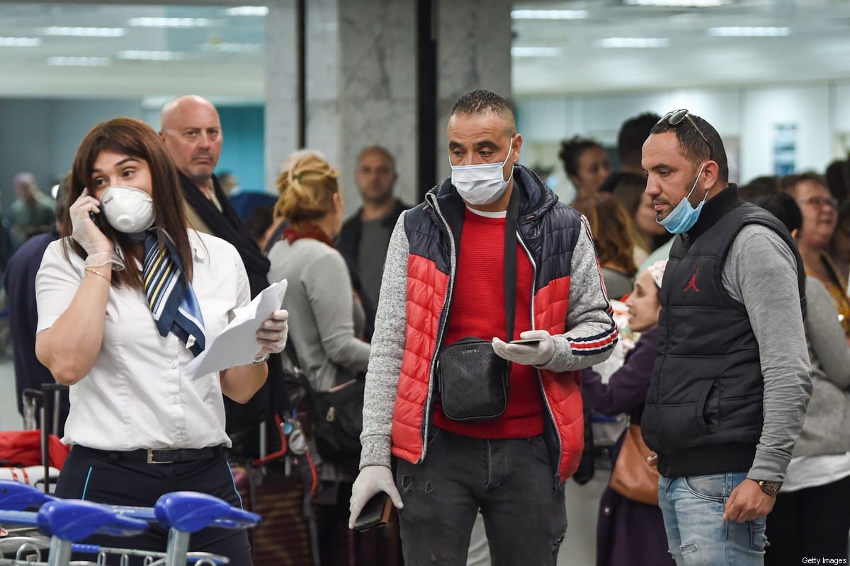 Passengers stranded at Tunis Carthage airport wait for flights on 16 March, 2020 [FETHI BELAID/AFP via Getty Images]