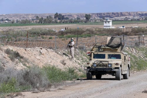 A soldier from the US-led coalition is seen at the Al-Qaim Military Base in Iraq’s Anbar province, west of Baghdad, on March 19, 2020. [Murtadha Al-Sudani - Anadolu Agency]