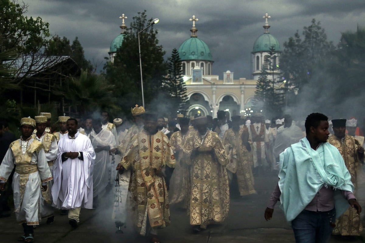 Ethiopian Orthodox Christians who gathered at Bole Medehanialem Church walk and pray for the immediate disappearance of coronavirus (Covid-19) pandemic, the end of death and the recovery of patients in Addis Ababa, Ethiopia on 24 March 2020. [Minasse Wondimu Hailu - Anadolu Agency]