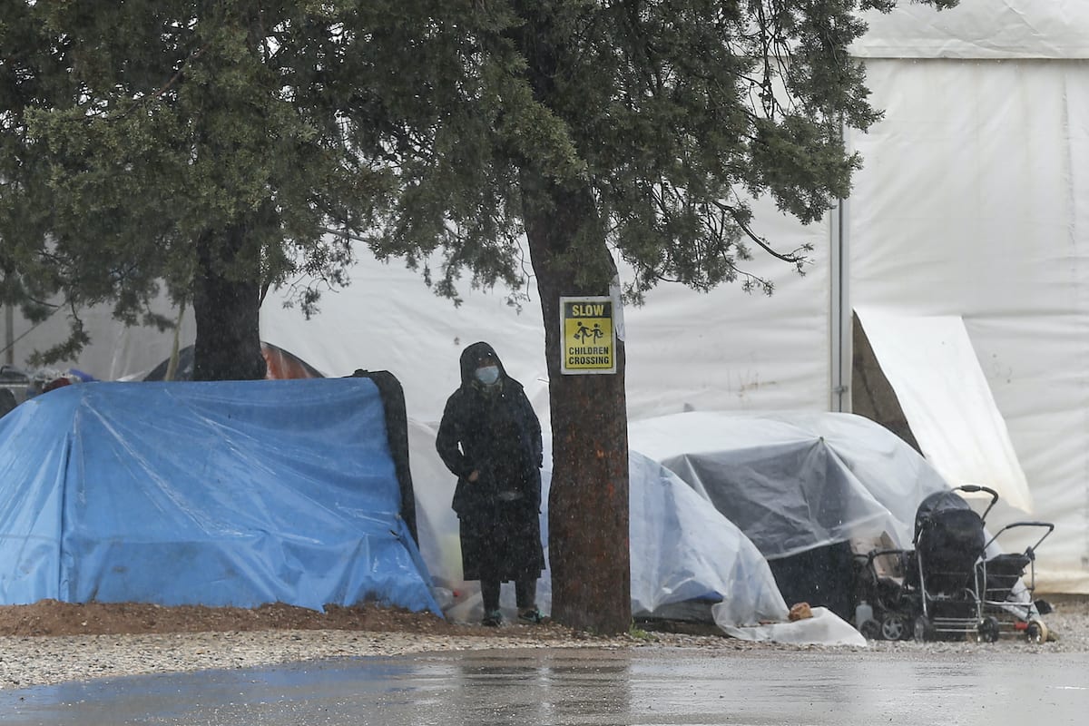 A woman wearing mask at a refugee camp in Greece on 5 April 2020 [Ayhan Mehmet/Anadolu Agency]