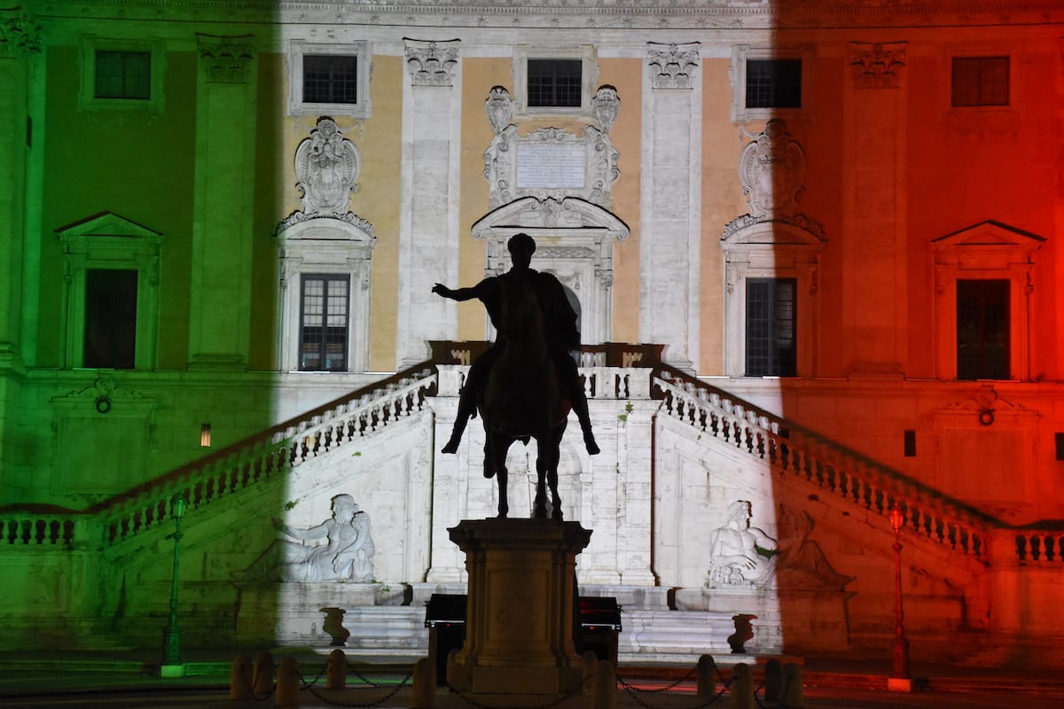 Rome's Municipal building is illuminated with the colours of the Italian national flag to show the fight against the new type of coronavirus (COVID-19) pandemic to curb at Campidoglio Square in Rome, Italy on 12 April 2020. [Barış Seçkin - Anadolu Agency]
