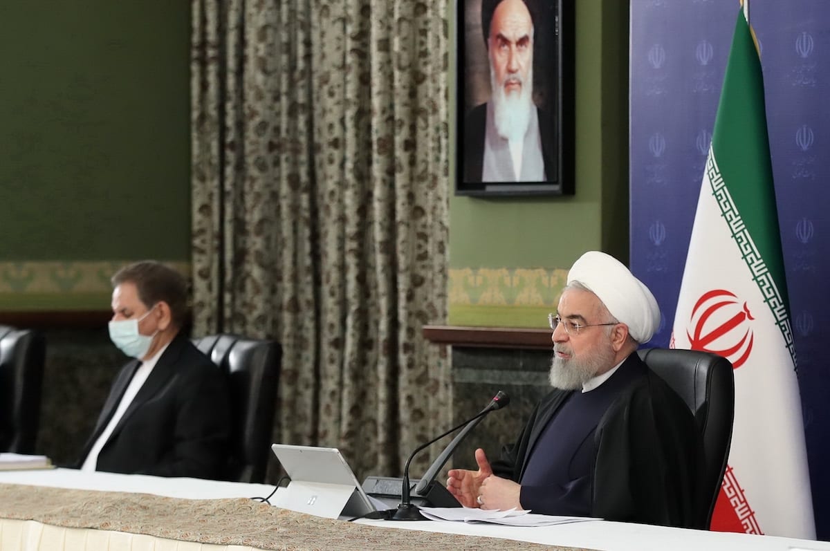 Iranian President Hassan Rouhani (R) speaks on the fall in oil prices due to the coronavirus (COVID-19) pandemic during a cabinet meeting in Tehran, Iran on 22 April 2020. [Presidency Of Iran / Handout - Anadolu Agency]
