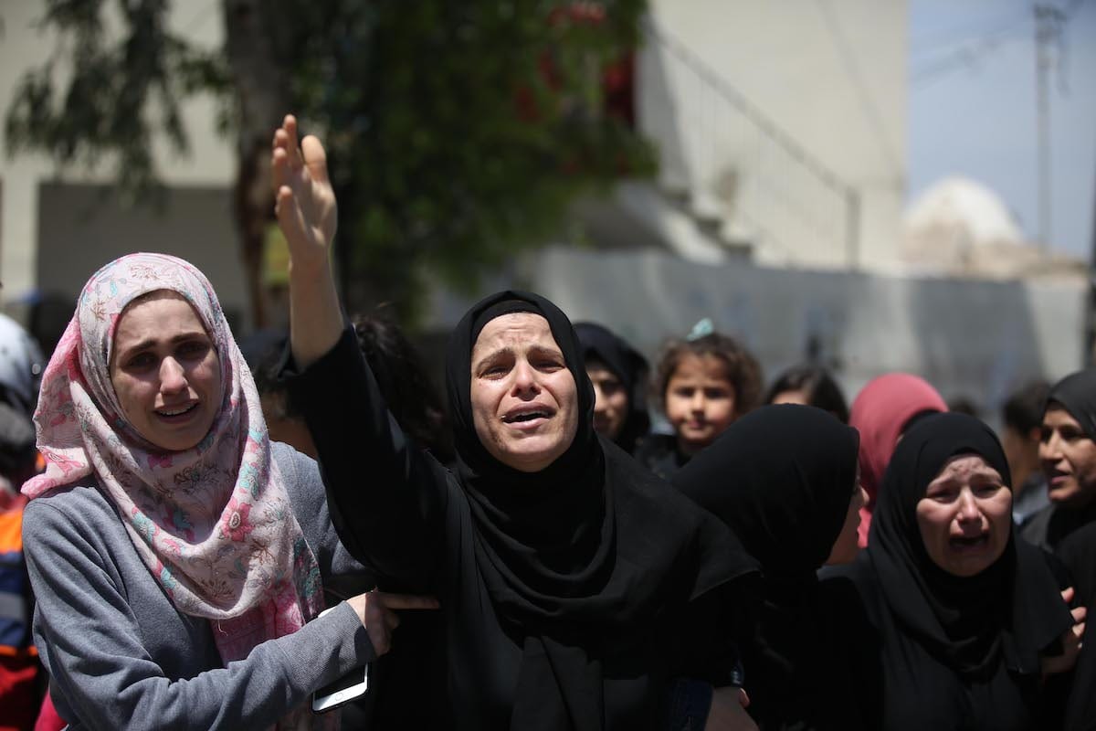Relatives of Nur Jabir al-Bergushi, 23, who died in Negev prison belonging to Israel, mourn during his funeral ceremony in the Aboud village of Ramallah, West Bank on 27 April 2020. [Issam Rimawi - Anadolu Agency]