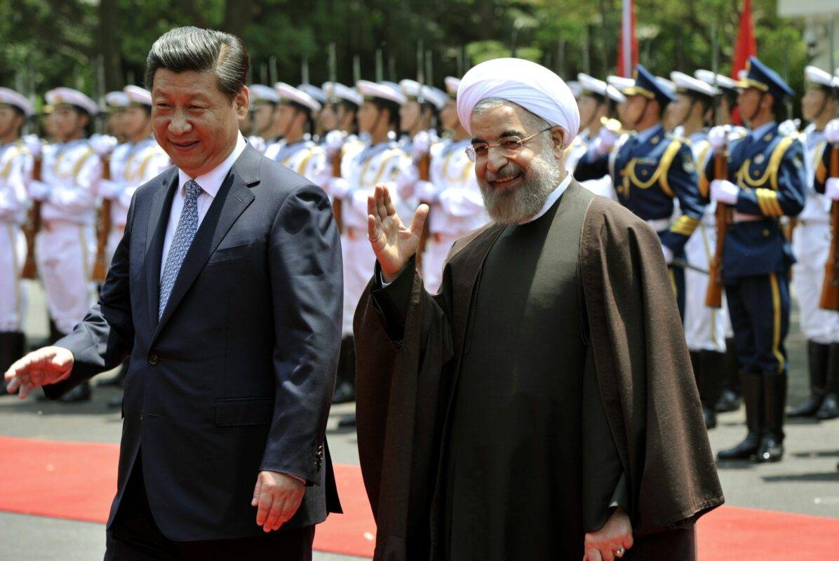 Iranian President Hassan Rouhani (R) and China's President Xi Jinping attend a welcoming ceremony at the Xijiao State Guesthouse in Shanghai on 22 May, 2014 [Kenzaburo Fukuhara/AFP via Getty Images]