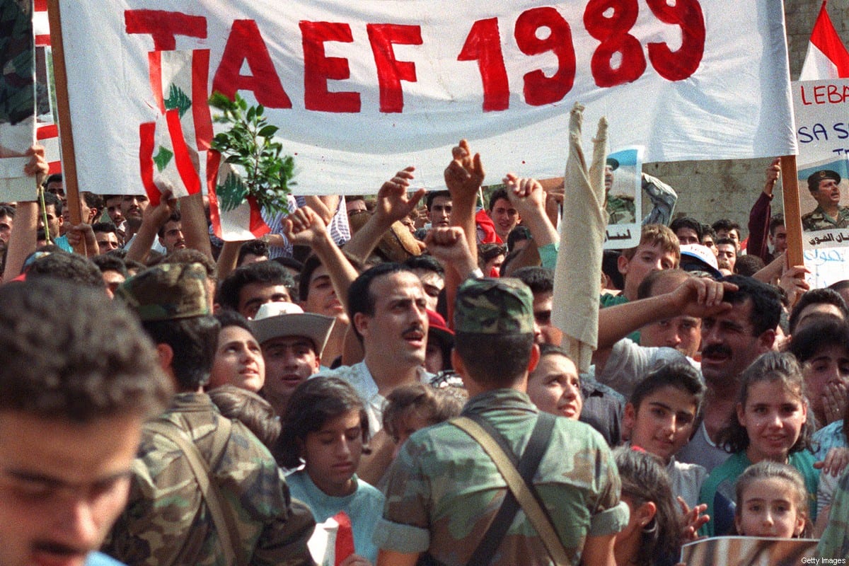 People come together following the Taif agreement on 4 November 1989 in Beirut, Lebanon [JOSEPH BARRAK/AFP/Getty Images]