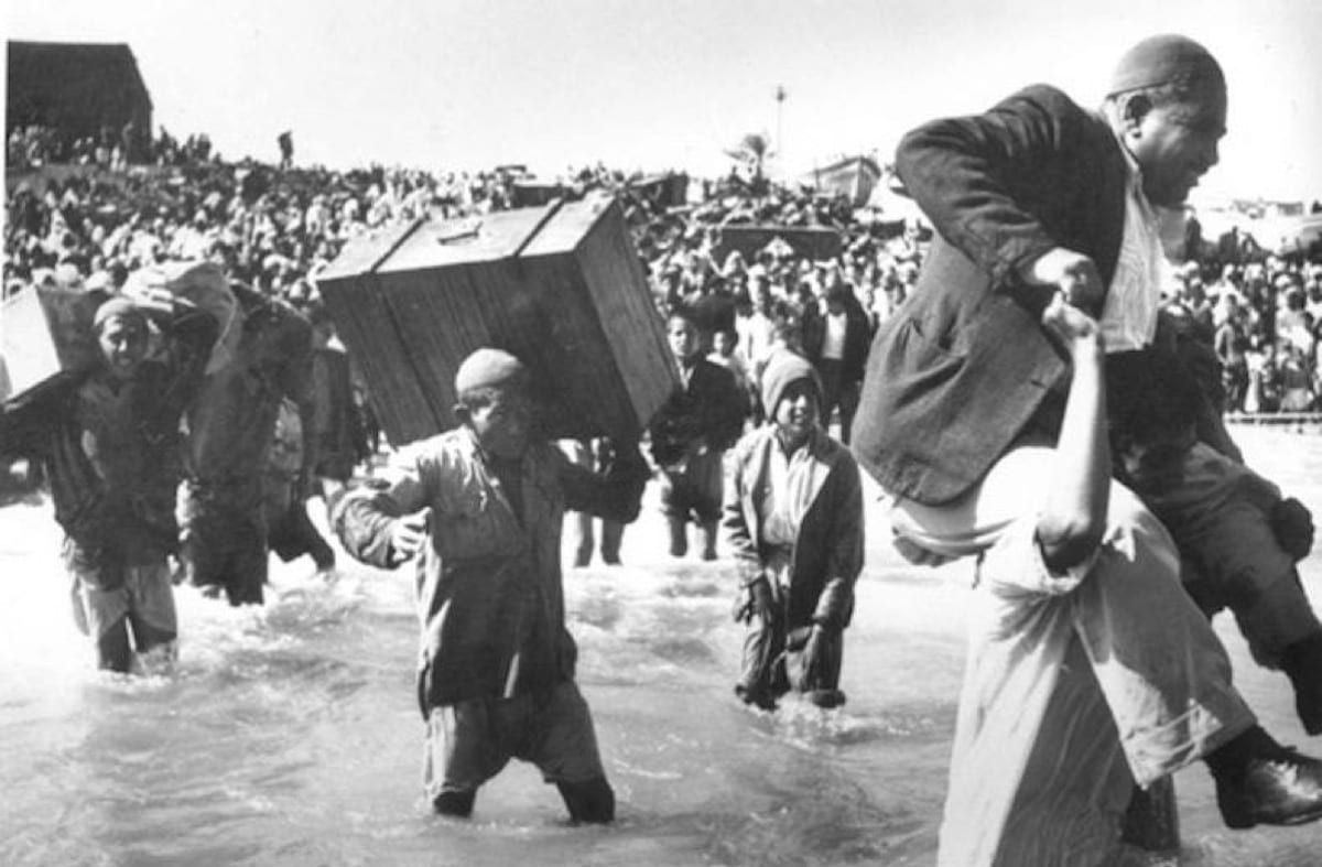 Palestinians can be seen fleeing their homes during the 1948 Nakba, also known as 'The Great Catastrophe'