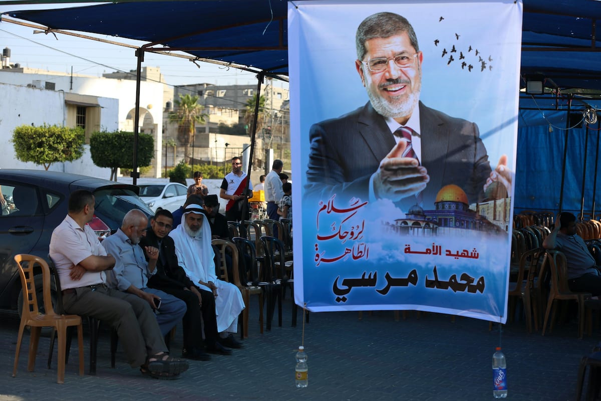 Palestinians receive condolences for the death of Egypt's former president Mohammed Morsi, in Khan Younis in the southern Gaza Strip on 19 June 2019. [Ashraf Amra/Apaimages]