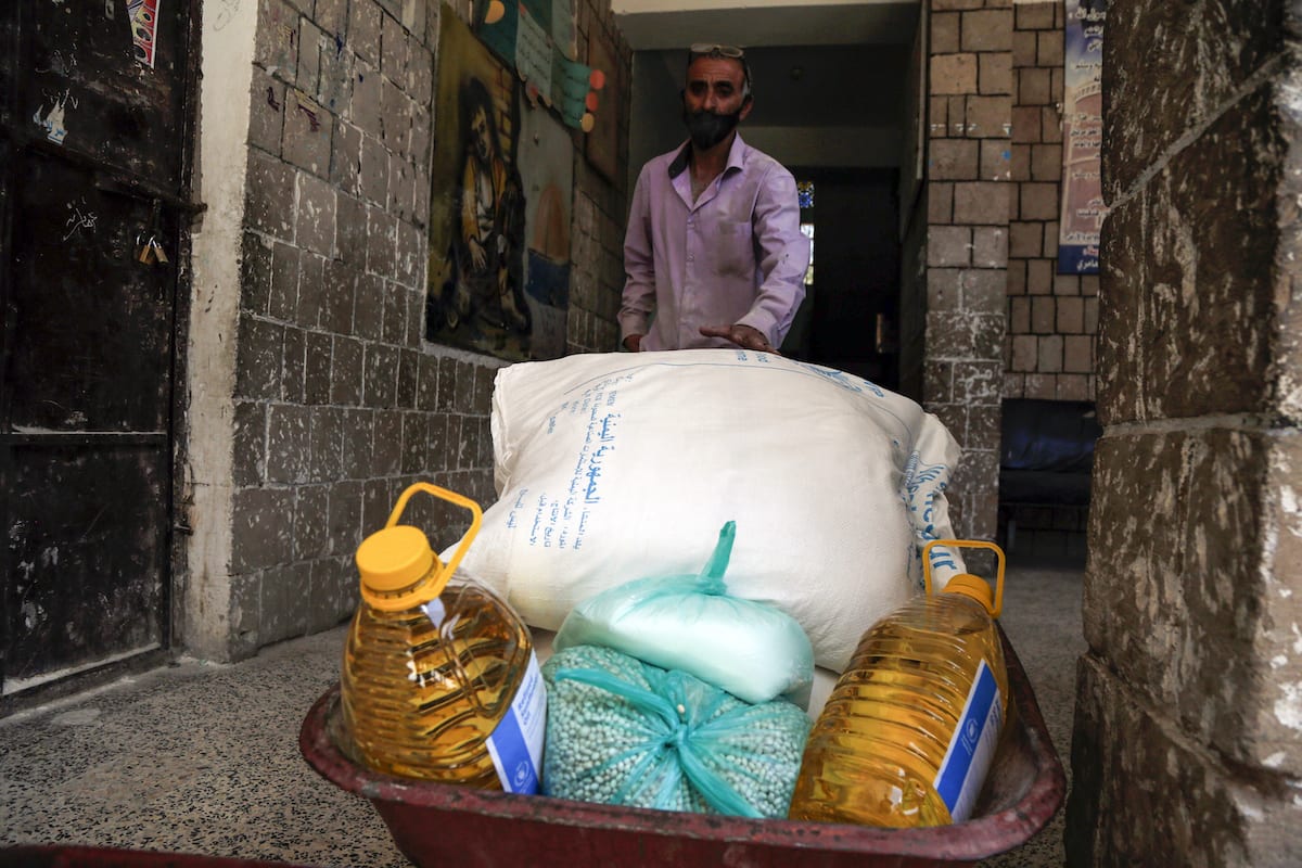 Food aid sent by World Food Program (WFP) is being distributed to needy people in Yemeni capital city Sanaa on 3 June, 2020 [Mohammed Hamoud/Anadolu Agency]