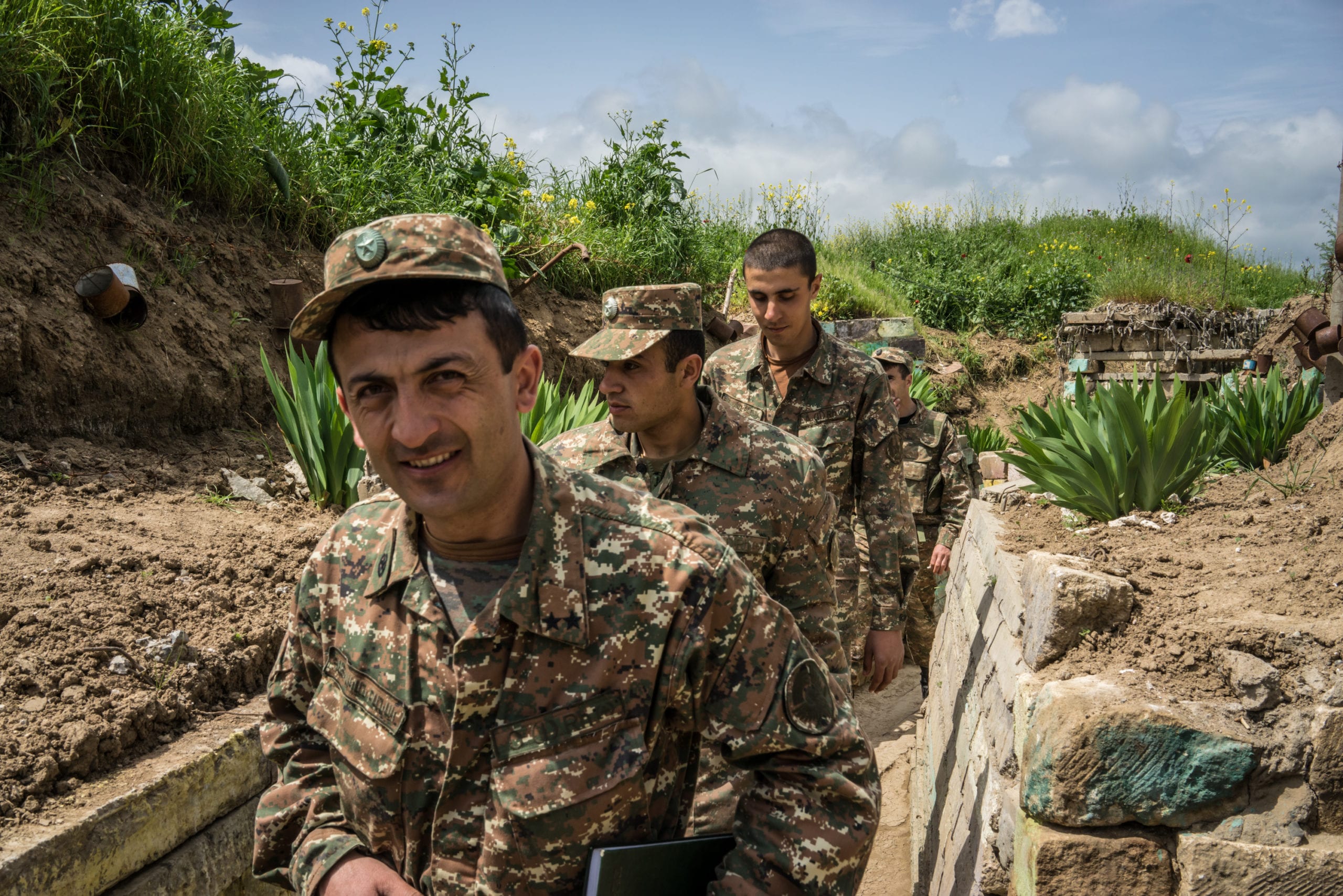 Members of the armed forces of Nagorno-Karabakh at their post along the line of contact with Azerbaijani forces on 21 April 2015 [Brendan Hoffman/Getty Images]
