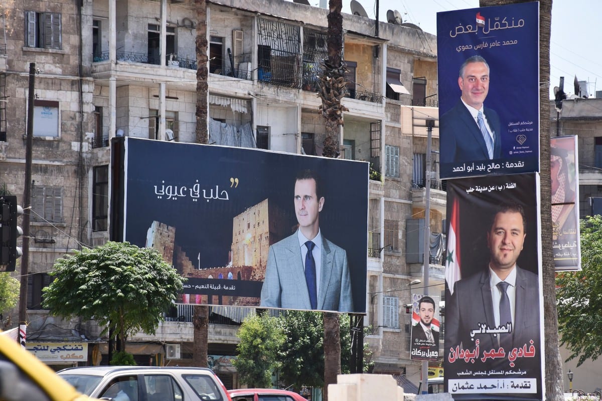 Campaign posters of candidates for the upcoming Syrian parliamentary election are displayed in the northern city of Aleppo, on July 15, 2020. (Photo by - / AFP) (Photo by -/AFP via Getty Images)