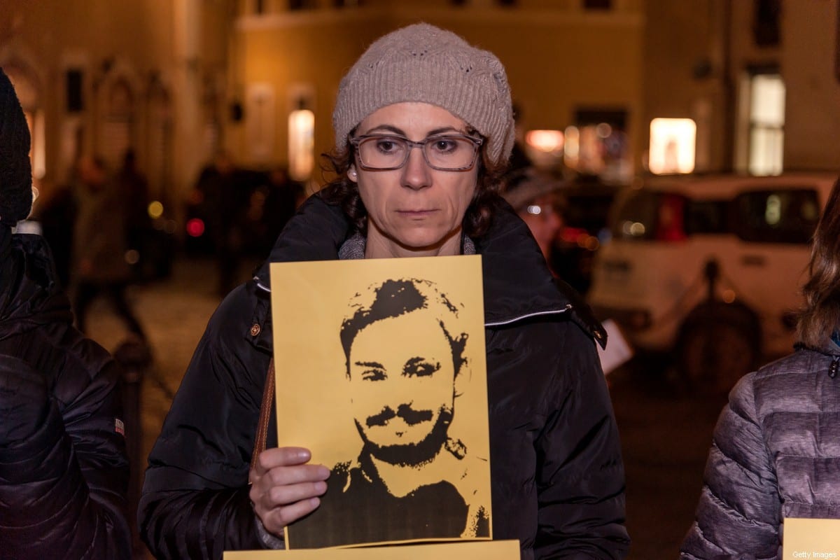 People take part in a torchlight procession organized by Amnesty International to commemorate the second anniversary of the death of Giulio Regeni on January 25, 2018 in Rome, Italy [Stefano Montesi/Corbis/Getty Images]