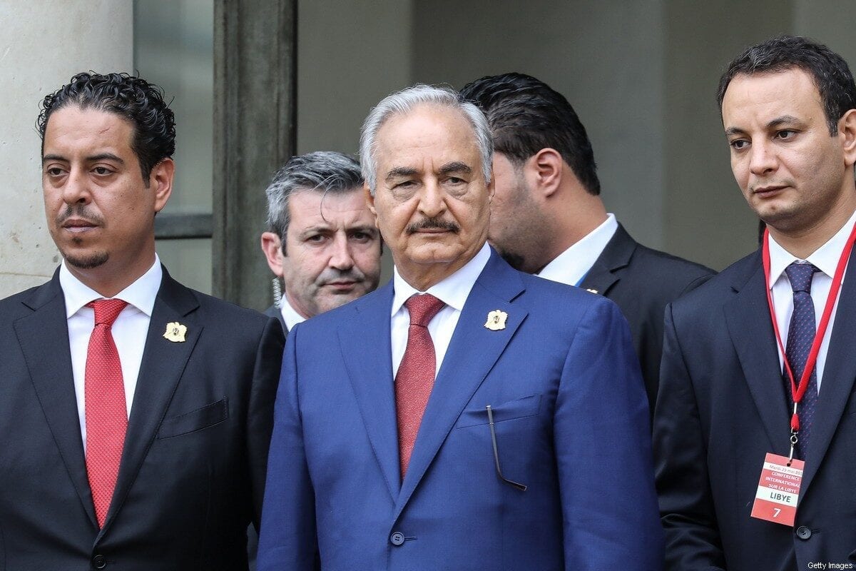 Libya Chief of Staff, Marshall Khalifa Haftar, whose rival Libyan National Army dominates the country's east, stands at the steps of the Elysee Palace with his delegation as they leave following the International conference on Libya in Paris on May 29, 2018. [LUDOVIC MARIN/AFP via Getty Images]