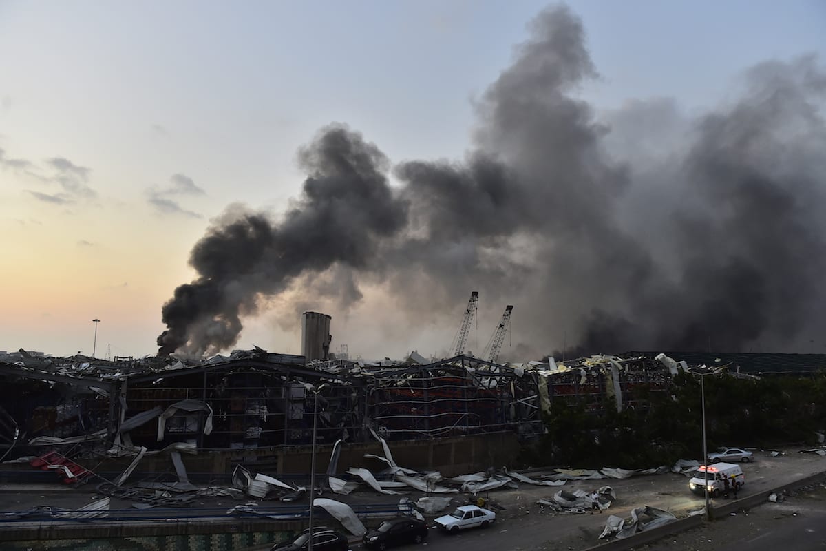 Smoke rises after a fire at a warehouse with explosives at the Port of Beirut led to massive blasts in Beirut, Lebanon on August 4, 2020 [Houssam Shbaro - Anadolu Agency]