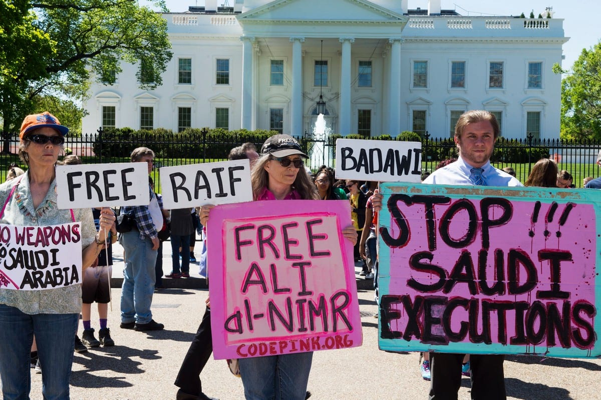 Protesters march in front of the White House bring attention to the plight of three Saudi Arabian youths, Ali Al-Nimr, Dawood Al-Marhoon, and Abdullah Al-Saher, all sentenced to death on 20 April 2016 [PAUL J. RICHARDS/AFP/Getty Images]