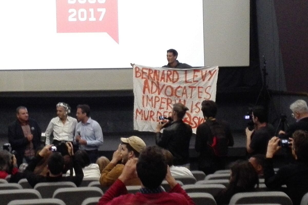 Bernard-Henri Lévy spoke in Belgrade regarding his movies in Beldocs movie festival, when audience member hit him with a pie and others chanted against him. [Wikipedia]