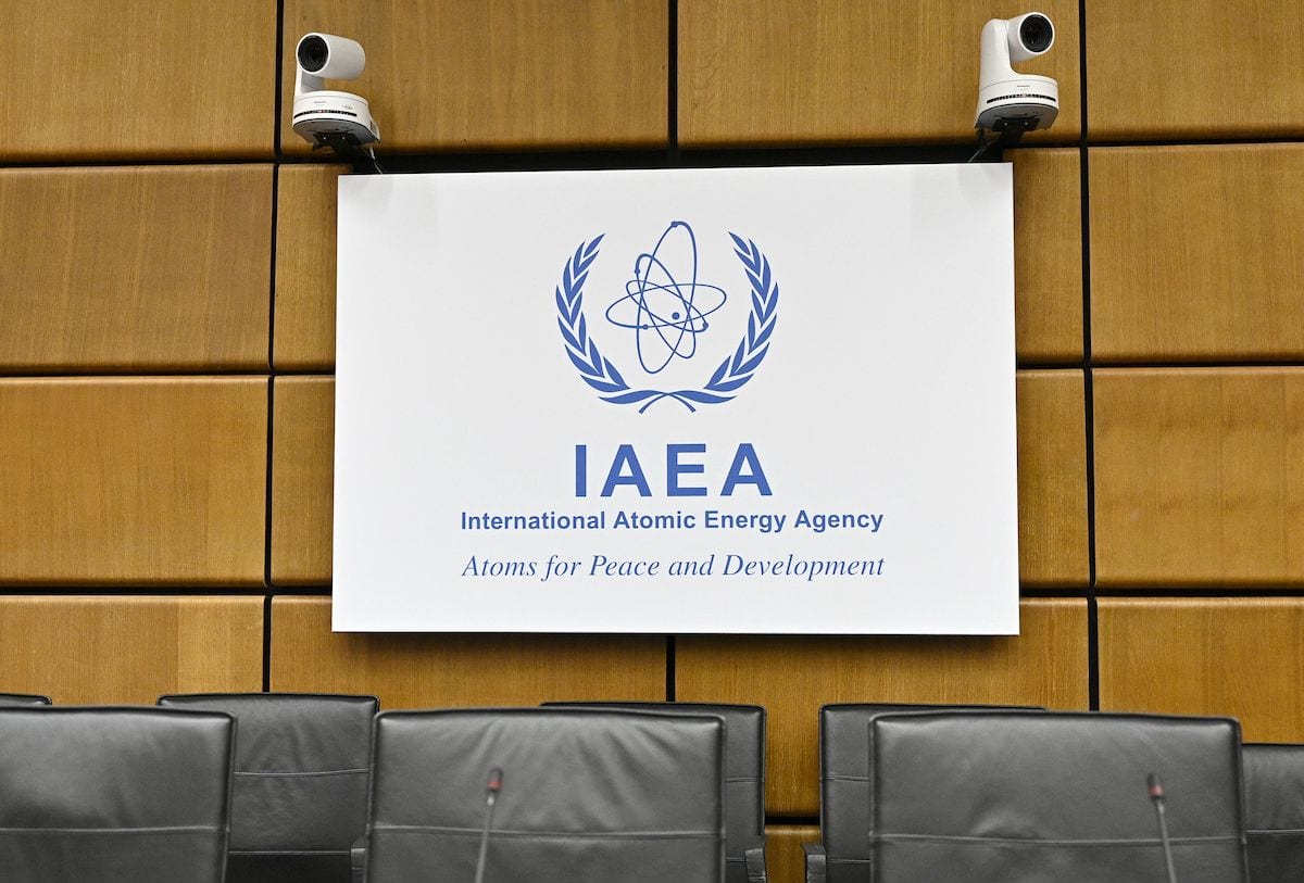 Empty chairs are seen in front of the logo of the International Atomic Energy Agency (IAEA) prior to a meeting in Vienna on 1 August 2019. [HANS PUNZ/AFP via Getty Images]