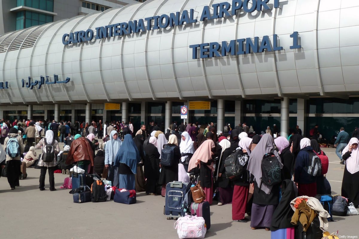 People crowd the entrance to Cairo's International Airport on February 3, 2011 [MICHEL MOUTOT/AFP/GettyImages]