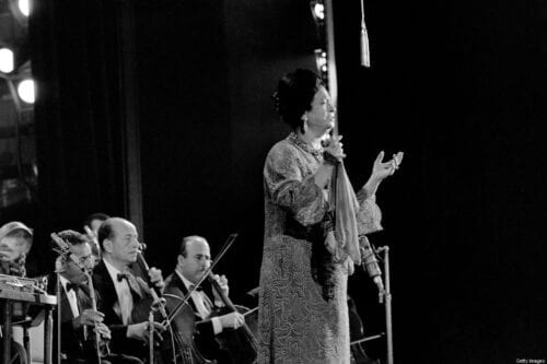 Egyptian singer Umm Kulthum performs on November 14, 1967 at the Olympia concert hall, in Paris. [Photo credit should read STRINGER/AFP via Getty Images]