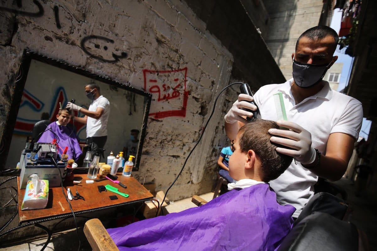 Palestinian barber snips away at coronavirus lockdown rules Middle
