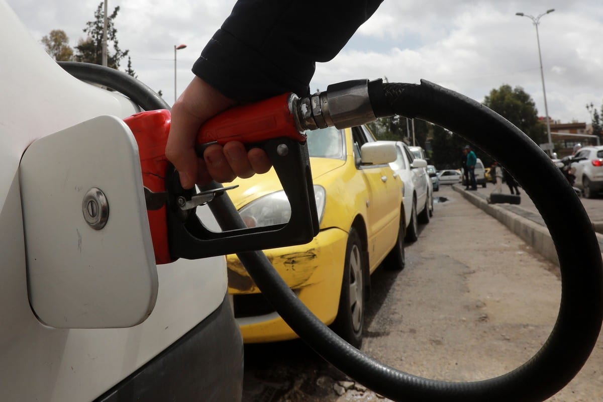 A driver fills his car with gasoline at a petrol station in the Syrian capital Damascus on 16 April 2019 [LOUAI BESHARA/AFP/Getty Images]