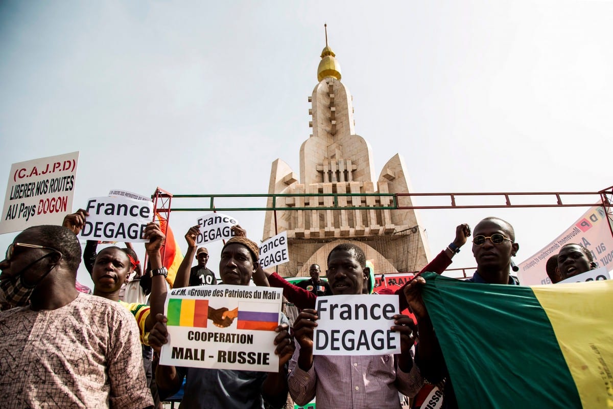 People hold up banners reading 'France get out' during a protest against French and UN forces based in Mali on 10 January 2020 [ANNIE RISEMBERG/AFP/Getty Images]