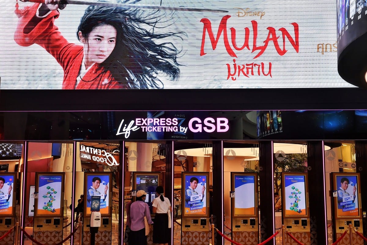 People buy tickets for Disneys Mulan film at a cinema in Bangkok on 8 September 2020 [LILLIAN SUWANRUMPHA/AFP/Getty Images]